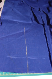 First I marked where I wanted the pleat in the lining to be.  By the way, the lining is Bemberg rayon.  I usually like to use crepe de cine for my linings, but I had this Bemberg in the right color, so I decided to use it.